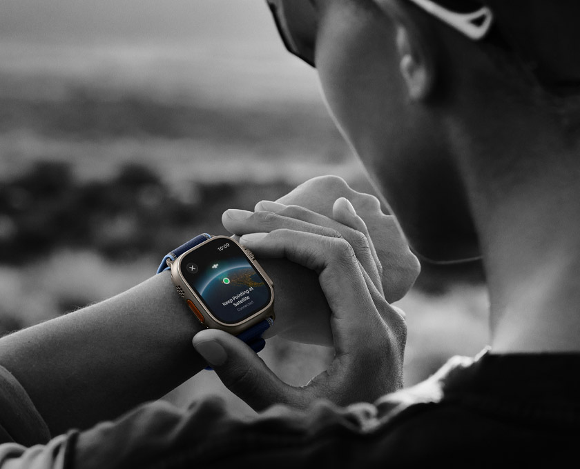A person uses two-way satellite communication on Apple Watch Ultra 3 while hiking