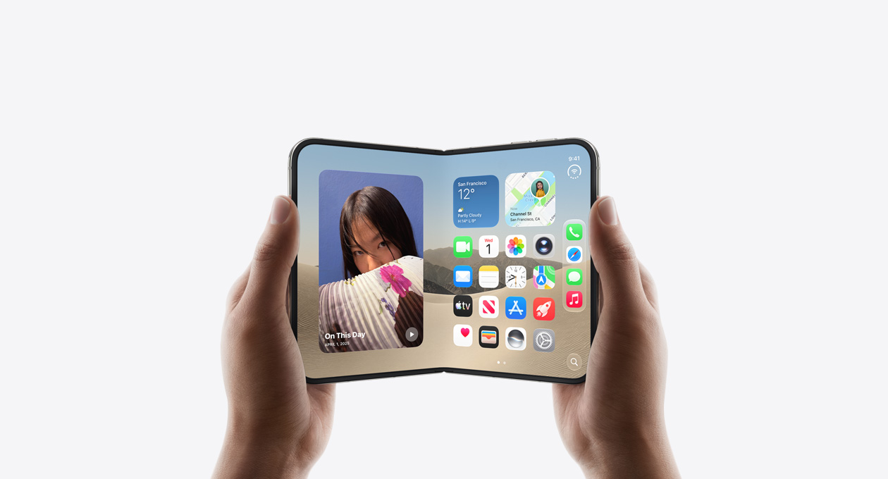 iPhone Duo, held by two hands in open landscape position, inside exterior, Star White colour, iOS home screen display, photos on the left, apps on the right