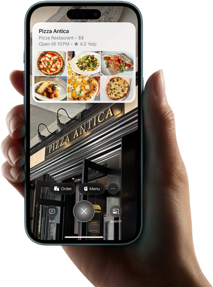 Käsi hoiab iPhone 16, näitamas visuaalintellekti otsingu tulemusi.