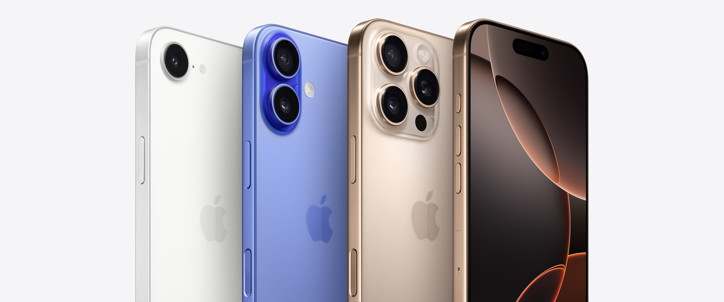 Four iPhone devices, including two iPhone 16 Pro models in Desert Titanium, one showing 3 camera lenses behind the other iPhone 16 Pro showing the Dynamic Island. Next to an iPhone 16 model in Ultramarine showing 2 camera lenses and an iPhone 16e model in White showing 1 camera lens.