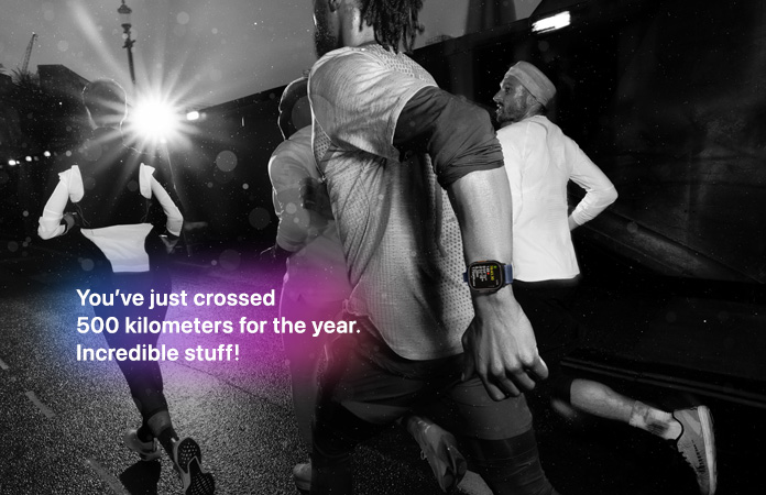 Black-and-white photo of people jogging, text over photo says You've just crossed 500 miles for the year. Incredible stuff!