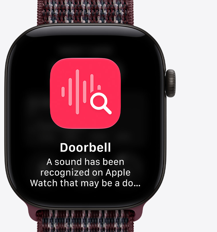 Apple Watch Series 12，黑色鋁金屬錶殼，配搭布根地紅色格子運動手環，螢幕顯示置頂對話畫面