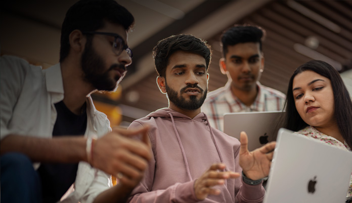 Student references their iPhone while interacting with it close to their face