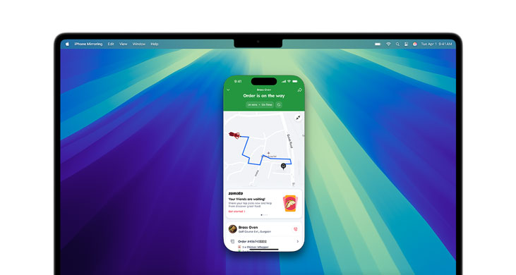 MacBook Pro M4 showcasing iPhone Mirroring and DoorDash app on screen.