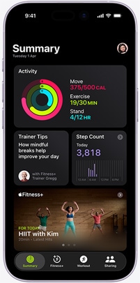 Apple Fitness+ app on an iPhone showing the Summary tab screen, featuring Activity rings, Trainer Tips, Step Count, and recommended Apple Fitness+ workouts