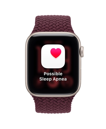 Apple Watch SE 3，螢幕顯示可能的睡眠窒息症通知，星光色鋁金屬錶殼，配搭布根地紅色編織運動手環，機身右側有數碼錶冠