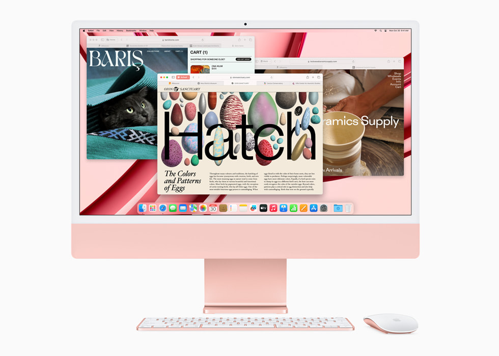 Safari op een nieuwe roze iMac met M3, met een toetsenbord en muis in bijpassende kleur.