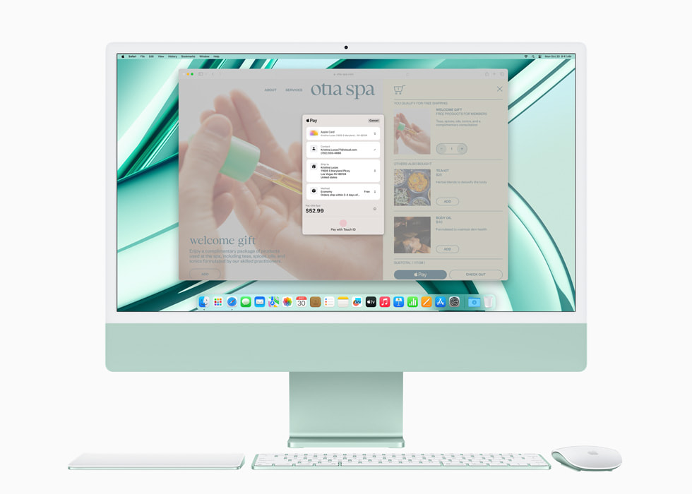 Apple Pay op een nieuwe groene iMac met M3, met een trackpad, toetsenbord en muis in bijpassende kleur.