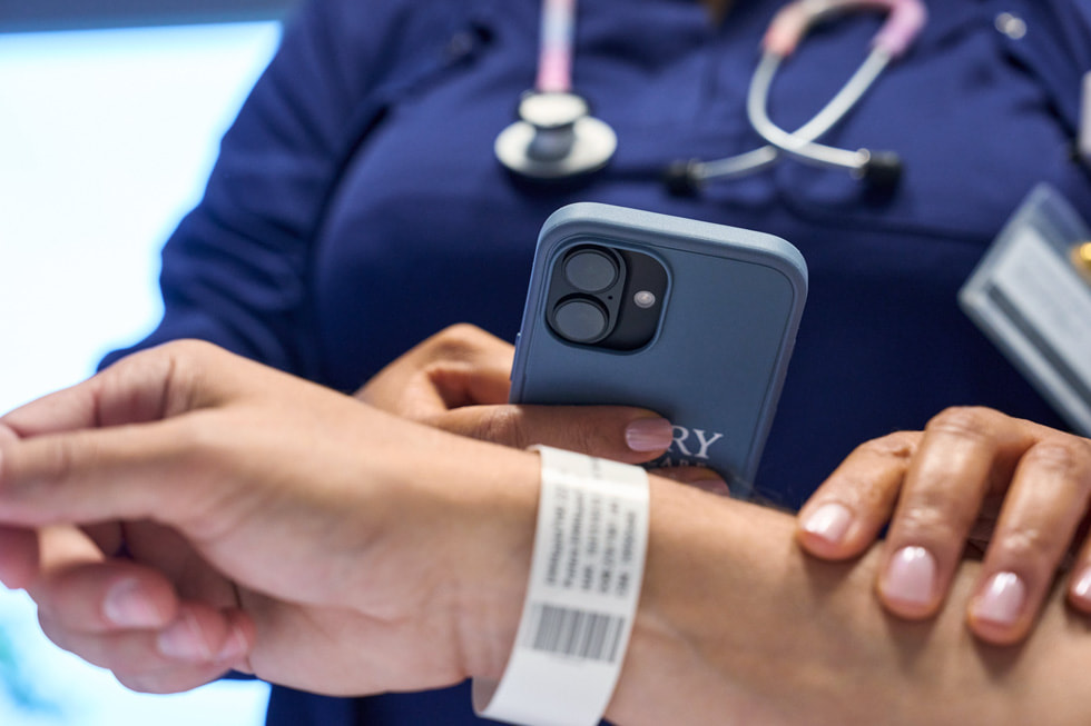 A care team member taking a scan of a patient’s ID bracelet at Emory Hillandale Hospital.