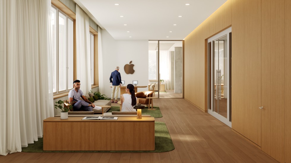 Three people sit on a long wooden bench in a minimalist reception area with light wood-paneled walls and a green rug.