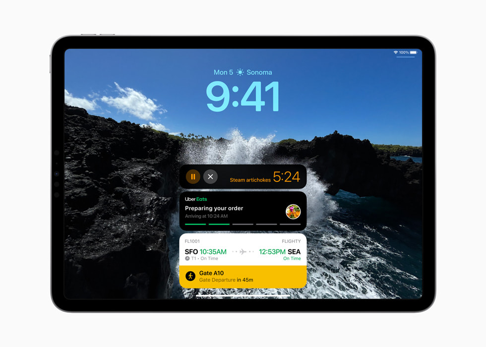 Un iPad Pro muestra Actividades en directo, incluyendo un temporizador, un pedido de Uber Eats e información sobre un vuelo en la pantalla de bloqueo.