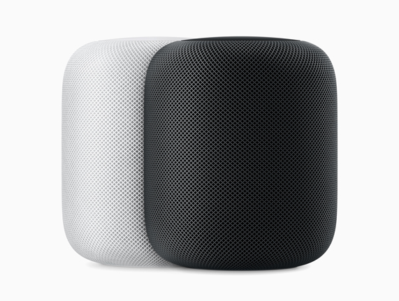 Beyaz ve uzay grisi HomePod hoparlörler.