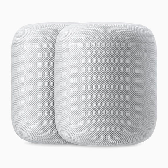 兩部白色的 HomePod 揚聲器。