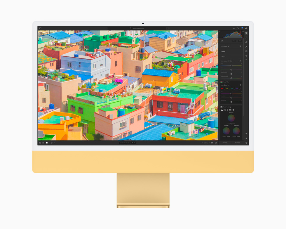 사진 앱을 사용해 편집된 사진을 보여주는 옐로 색상의 iMac.