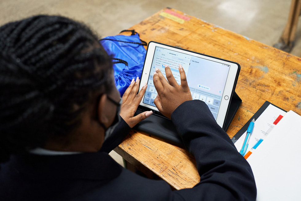 A Boys & Girls Clubs of America student works on iPad.