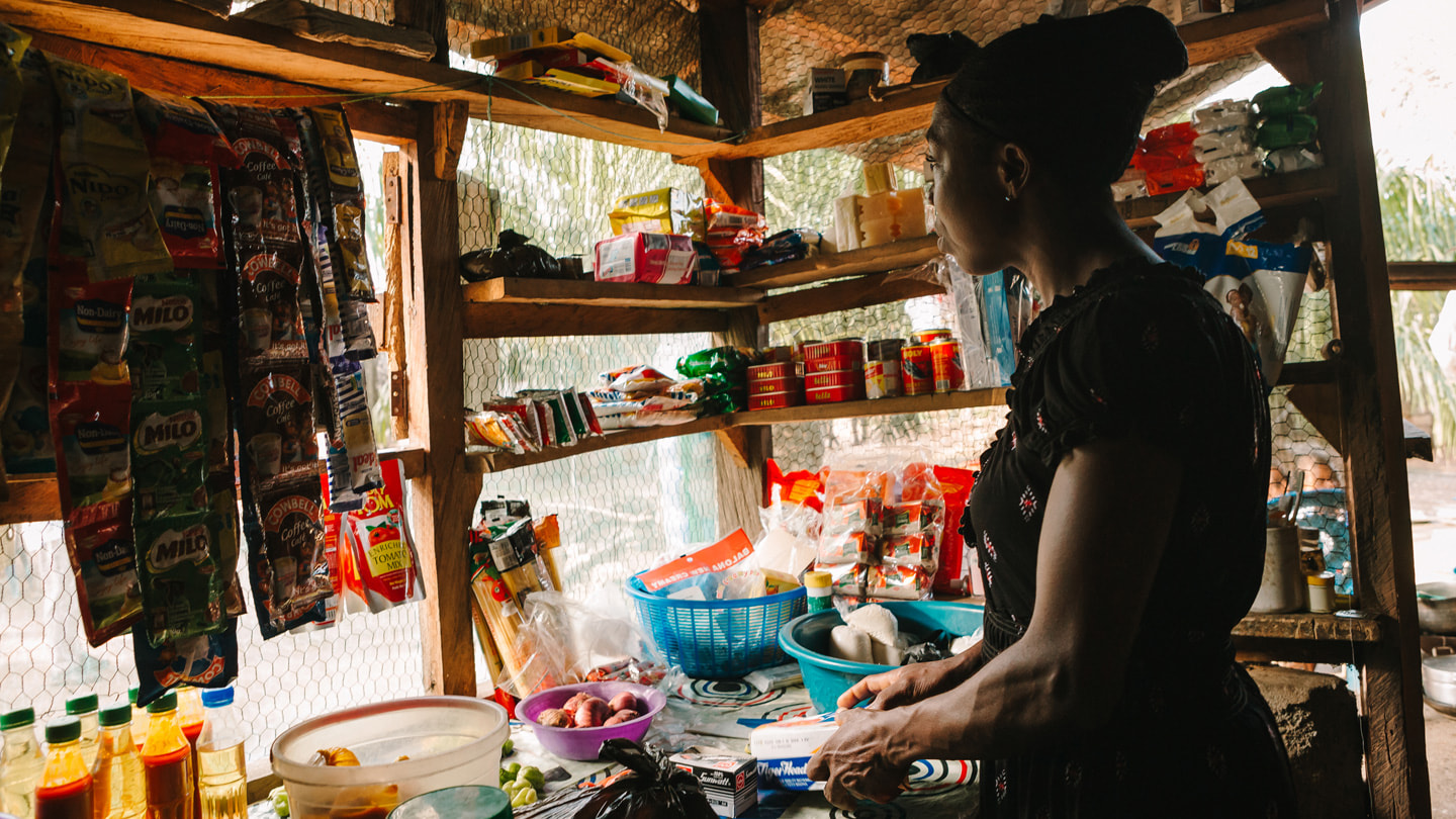 Model of Hope programme volunteer Rebecca working inside her shop.