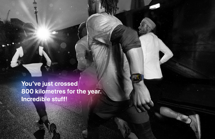 Black-and-white photo of people jogging, text over photo says You’ve just crossed 800 kilometres for the year. Incredible stuff!