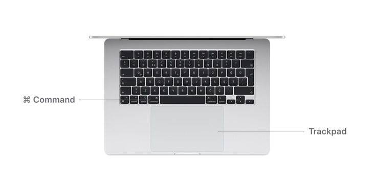 MacBook Air M4 Command tuşu düğmesi ve trackpad’in masa görüntüsü.