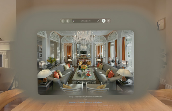 Safari web page featuring inline spatial scene of living room with long deep hallways in background