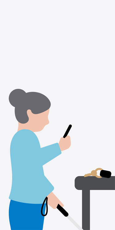 Ilustración de una mujer de perfil que está de pie, sostiene un bastón blanco, señala con un iPhone unas llaves sobre una mesa delante de ella