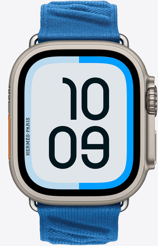 Apple Watch Hermès Ultra 2 的正面圖，展示 Maritime 錶面和全新 Bleu Hydra 水妖藍色 En Mer 錶帶 (海藍色 Marine Blue)。