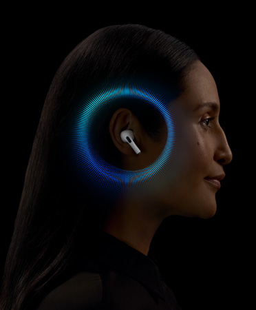 A person wearing AirPods Pro 2 with soundwaves animating around the ear