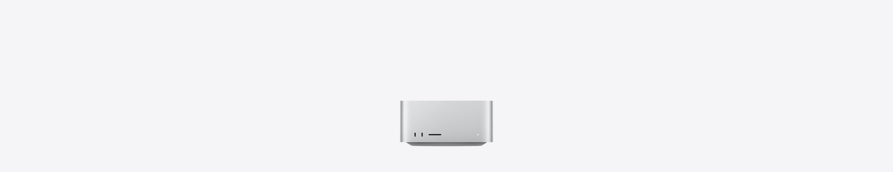 Parte da frente do Mac Studio prateado com duas portas USB-C, slot para cartão SDXC, luz indicadora de status, base mais estreita, parte superior reta, laterais arredondadas e bordas retas