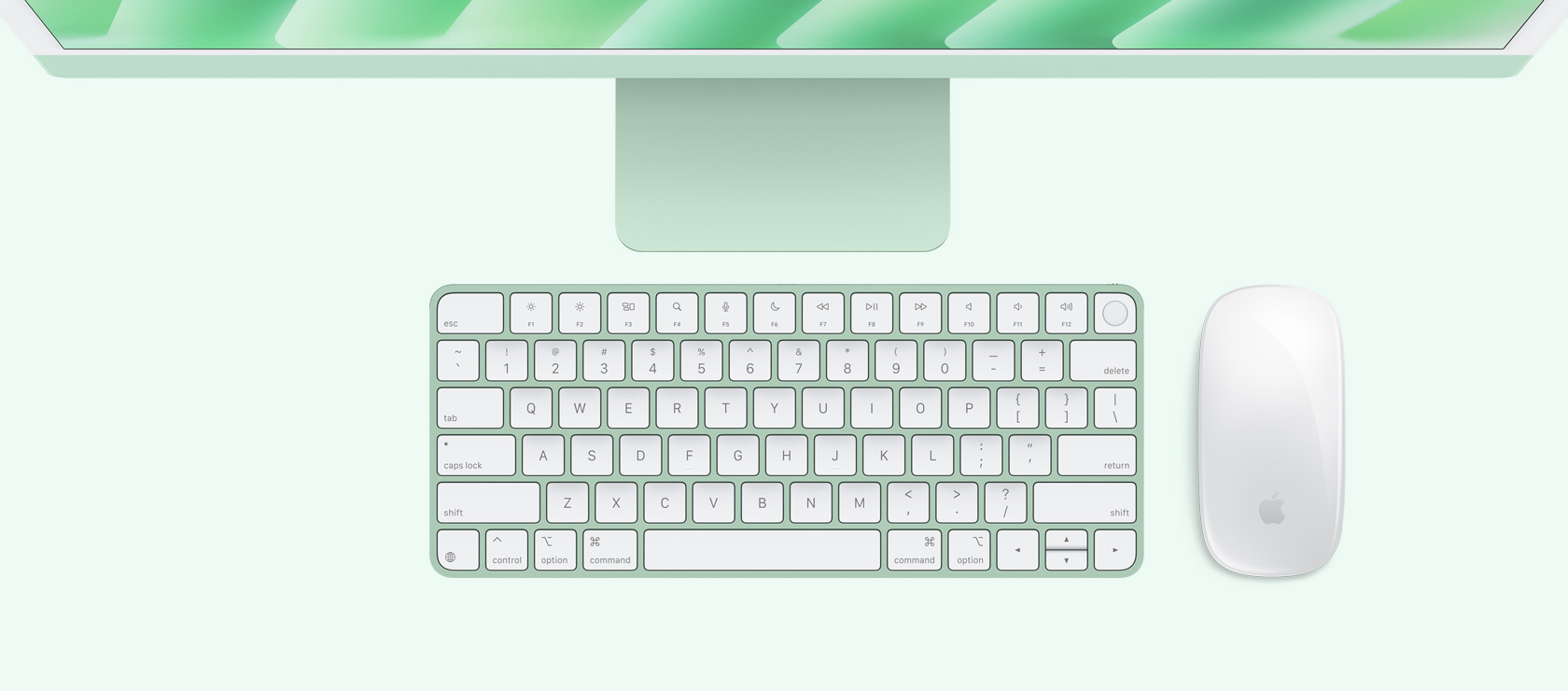 俯視圖展示綠色 iMac 配上襯色的滑鼠和鍵盤