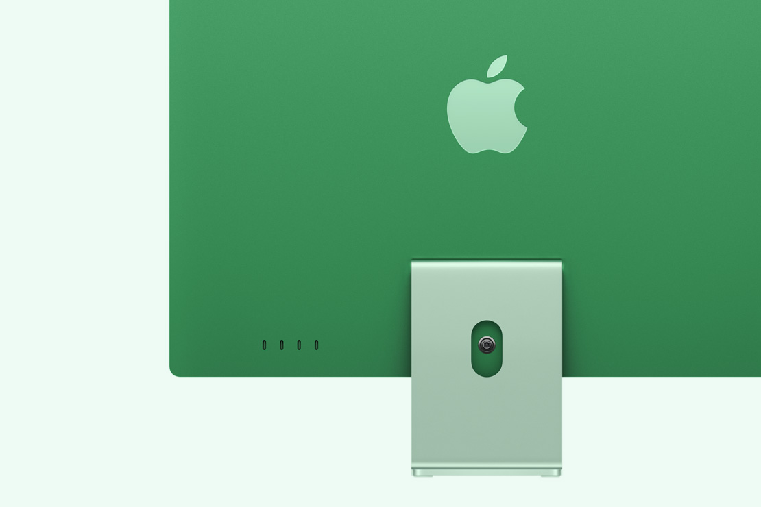 綠色 iMac 背面，展示四個 USB-C 連接埠。