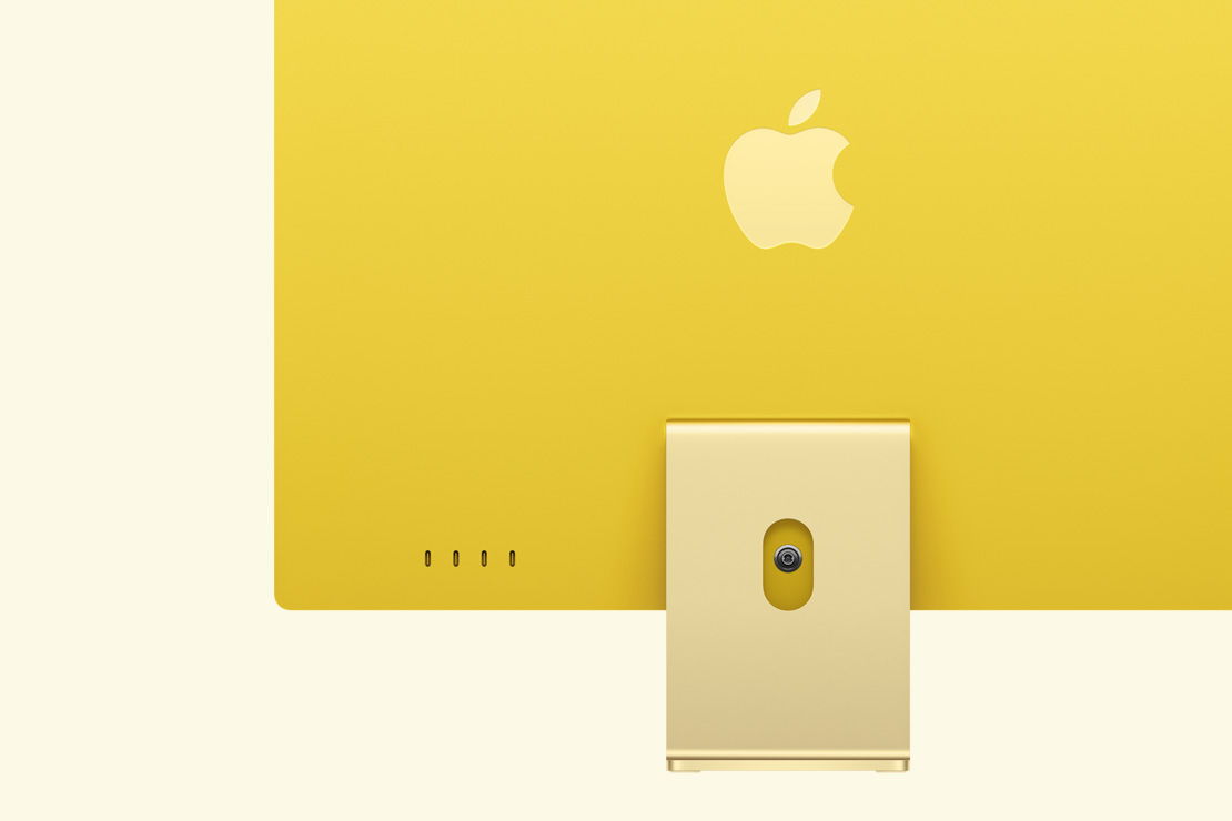 黃色 iMac 的背面，展示四個 USB-C 連接埠