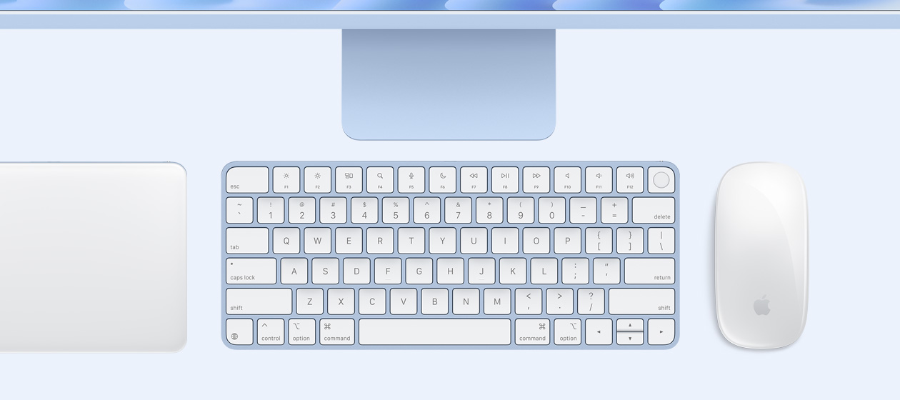 俯視圖展示 iMac 配有精妙觸控板、鍵盤及滑鼠。