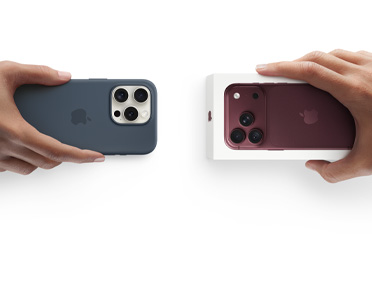 Hands exchanging trade-in iPhone 13 with Silicon cover, stickers on back exterior, for new iPhone 18 Pro in the box.