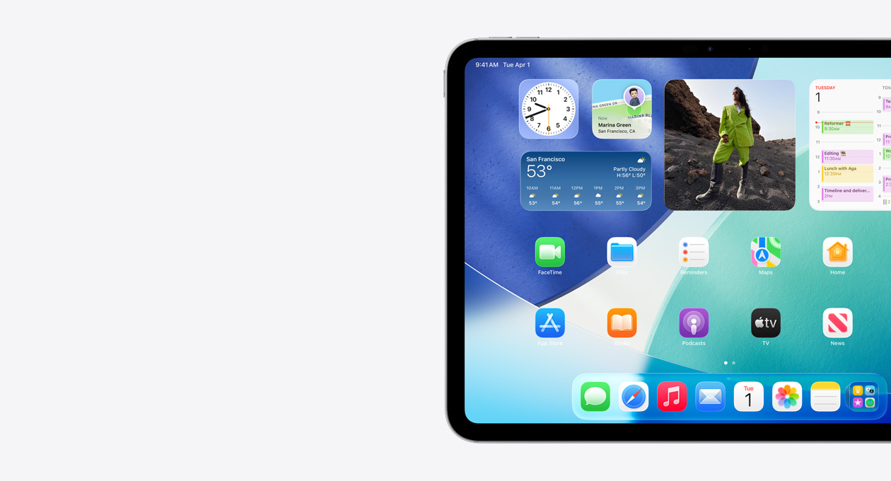 iPad, landscape orientation, left side of screen only, Home Screen with stacked widgets including translucent clock showing Liquid Glass effect, Find My app, Weather widget, two rows of smaller apps, and the Dock