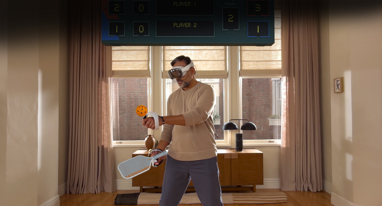 Man wearing Apple Vision Pro and Sony PlayStation VR2 Sense Controller playing Pickle Pro game, spatial scoreboard above his head