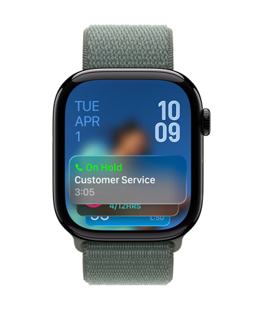 Peilimusta Apple Watch ja salvianvihreä ranneke, kellotaulun alaosassa näkyy Puheluapurin ilmoitus, päivämäärä vasemmassa yläkulmassa, ajan numerot oikeassa yläkulmassa päällekkäin
