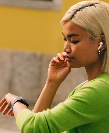 Woman looking at her Apple Watch