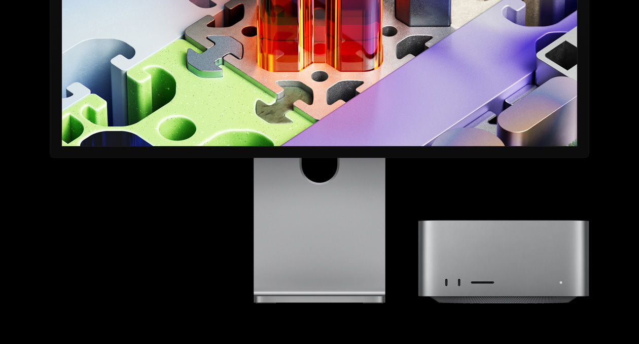 Una flor metálica prismática parece florecer en la pantalla del monitor Studio Display XDR con una Mac Studio debajo
